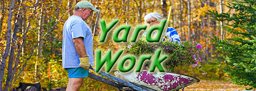 Yard Work - couple with wheel barrel working in yard